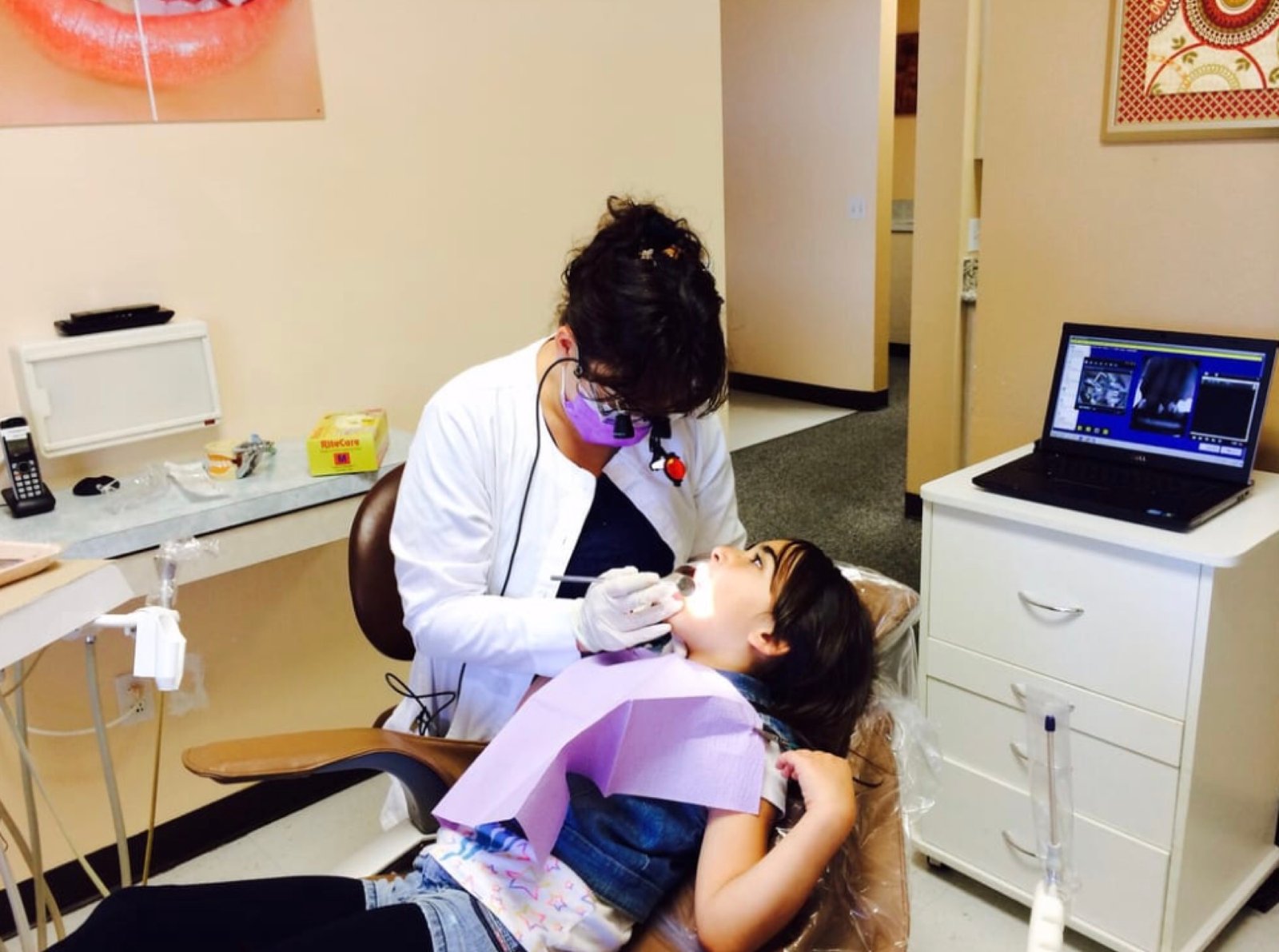 Dr. Michelle Majd treating a young patient at Prime Dental Care